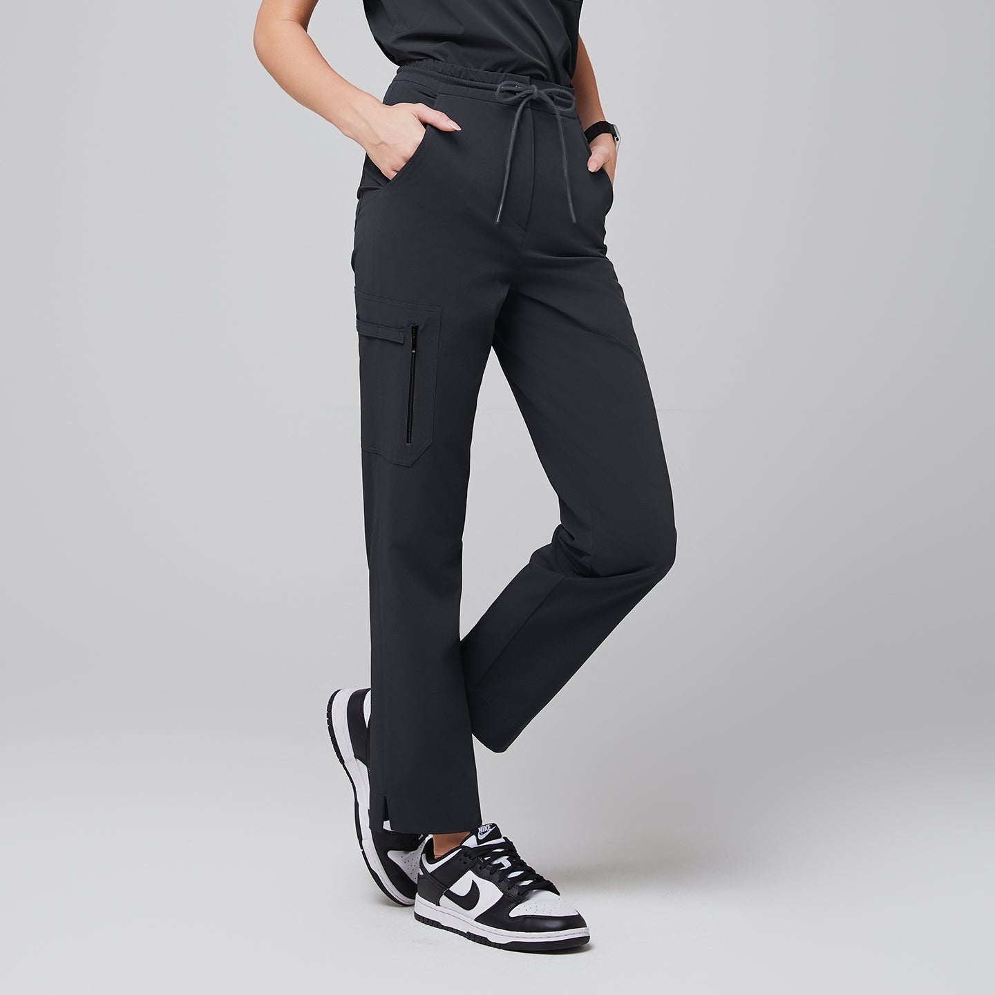Image of Deep Gray Zipper Pocket Split Hem Scrub Pants with straight-leg design, zip cargo pocket, and subtle ankle slit for a sleek professional look.