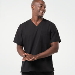 Image of A smiling male model wearing a short-sleeve 3 Pocket scrub top in Eco Black.