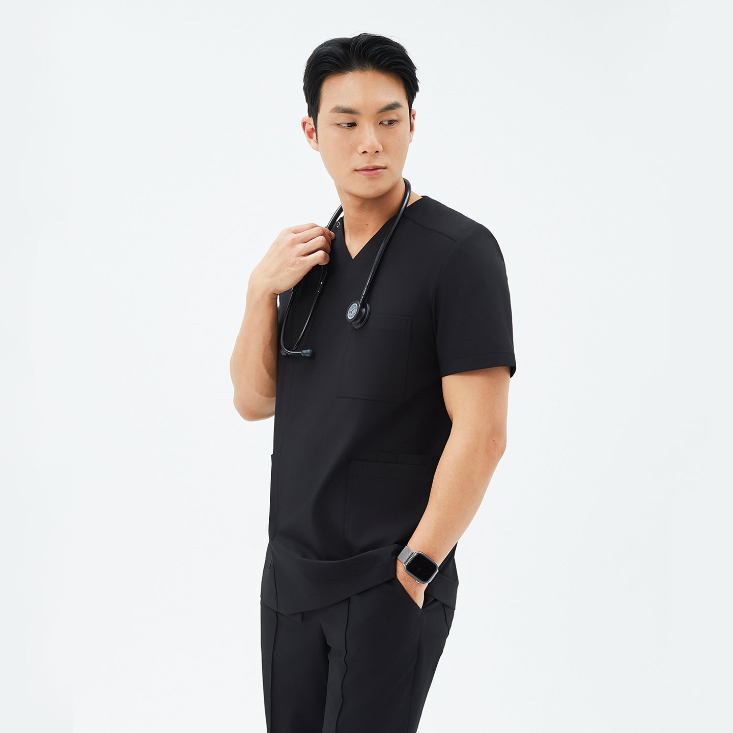 Image of Side angle of TUL DS-184 Men's Eco Black scrub top, highlighting the tailored fit and clean, contemporary design.