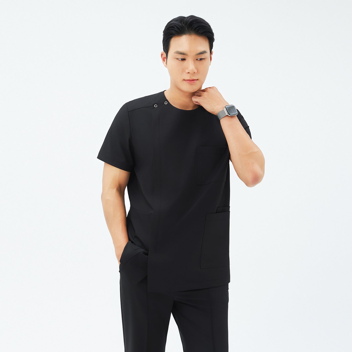 Front view of TUL DS-187 Men's Round Snap Zipper Scrub Top in Eco Black, highlighting the round snap collar and sleek front zipper.