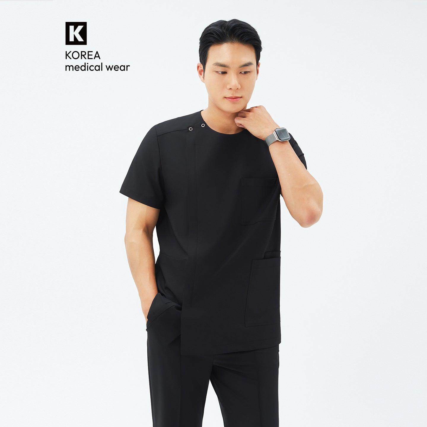 Image of Front view of TUL DS-187 Men's Round Snap Zipper Scrub Top in Eco Black, highlighting the round snap collar and sleek front zipper.