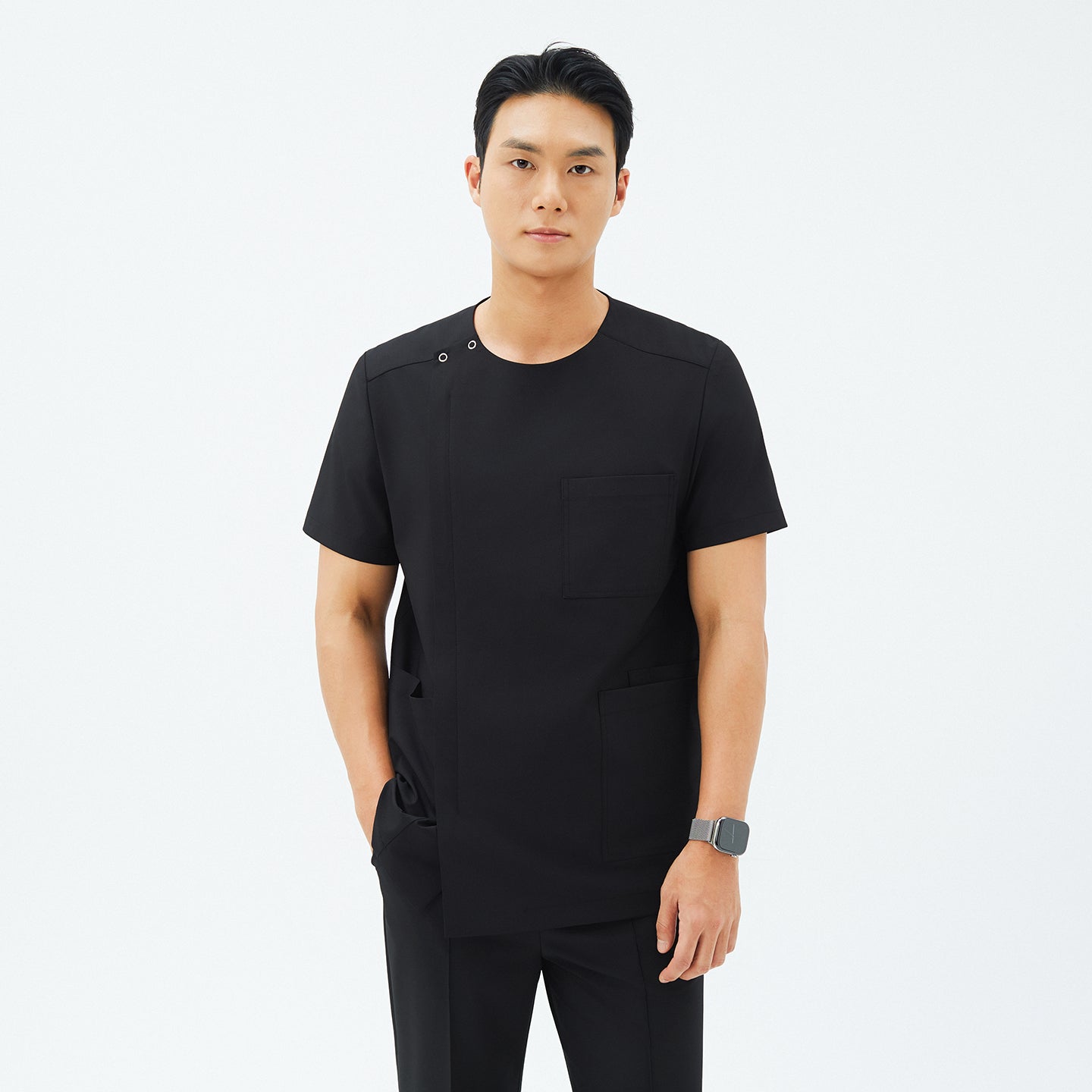 Image of Front view of TUL DS-187 Men's Round Snap Zipper Scrub Top in Eco Black, highlighting the round snap collar and sleek front zipper.
