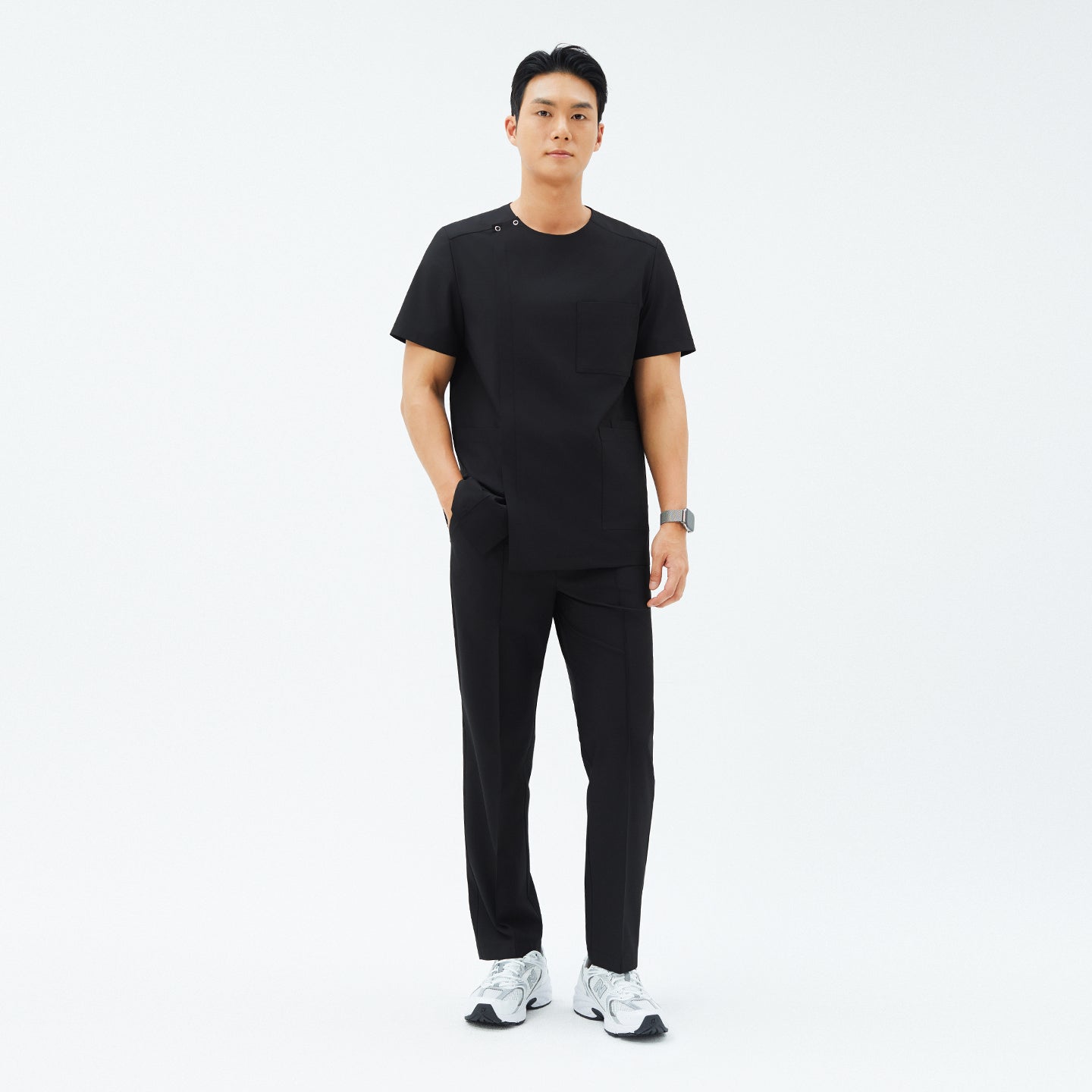 Image of Full-length view of TUL DS-187 Men's Round Snap Zipper Scrub Top in Eco Black, paired with matching pants for a cohesive, professional look.