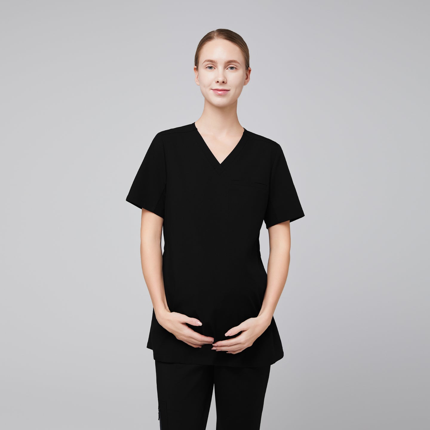 Image of scrub top, women standing with wearing black scrub top,Eco Black