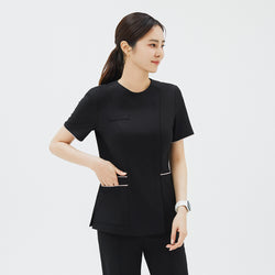 Image of Side angle of TUL OS-206 Women's Edge Stripe Scrub Top in Eco Black, showcasing convenient front pockets with contrast piping.