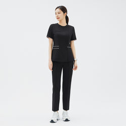 Image of Full outfit featuring TUL OS-206 Eco Black scrub top and matching pants, emphasizing a streamlined and professional look.