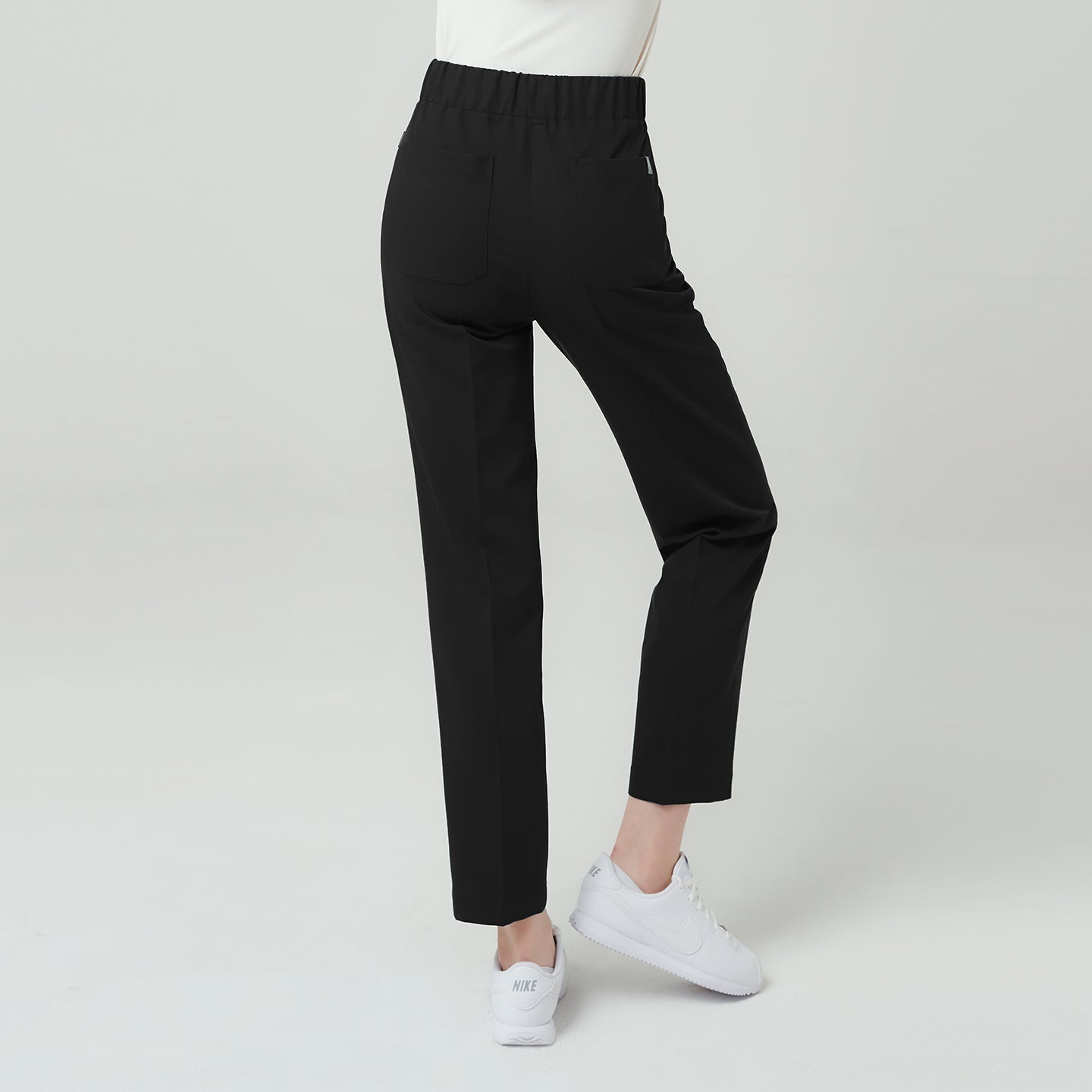 Eco Black Women’s Premium Banding Pants back view, featuring high-rise elastic waistband and clean straight-leg silhouette for a sleek professional look.
