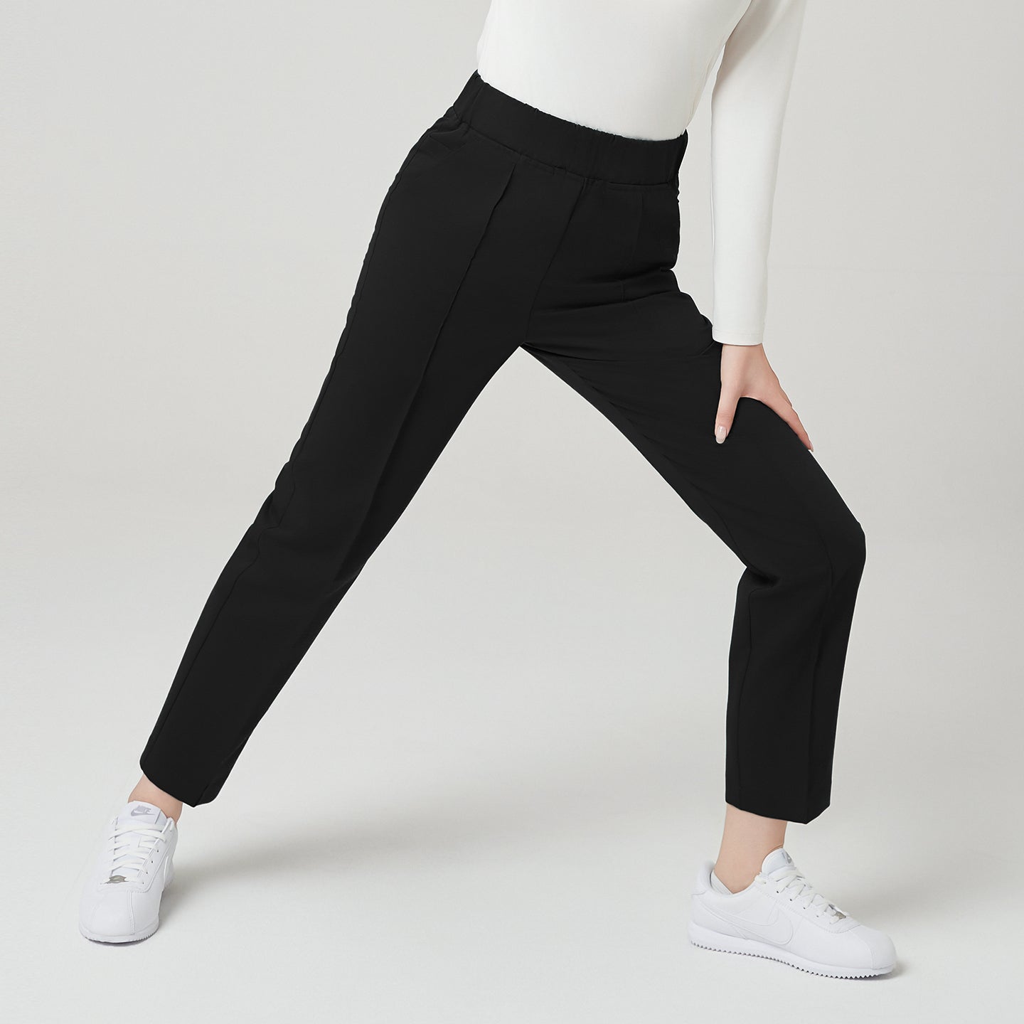Image of Front view of TUL Women's Premium Banding Pants in Eco Black, featuring a slim, tailored cut and comfortable waistband.