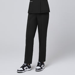 Image of Side angle of TUL Women's Premium Banding Pants in Eco Black, highlighting the straight-leg design and durable stretch fabric.