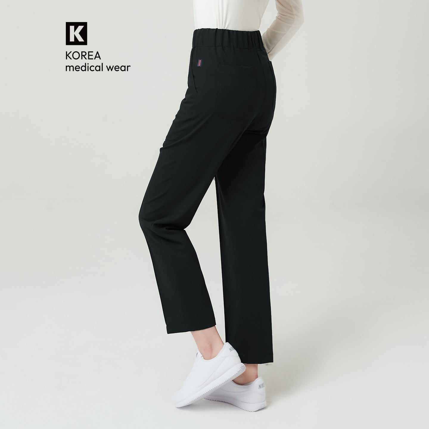 Image of Eco Black Women’s Premium Banding Pants featuring an elastic high-rise waistband, straight-leg silhouette, and back pocket detail.