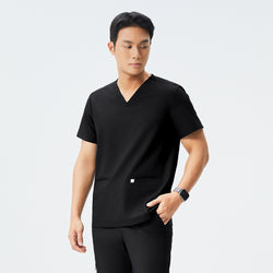 Image of Man wearing black scrubs with a V-neck and double pockets, standing with arms crossed and a confident expression,Eco Black