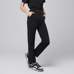 Image of Modern scrub pants featuring a drawstring waist, functional side zipper pocket, and split hem accents, paired with athletic sneakers for a professional yet comfortable look,Eco Black