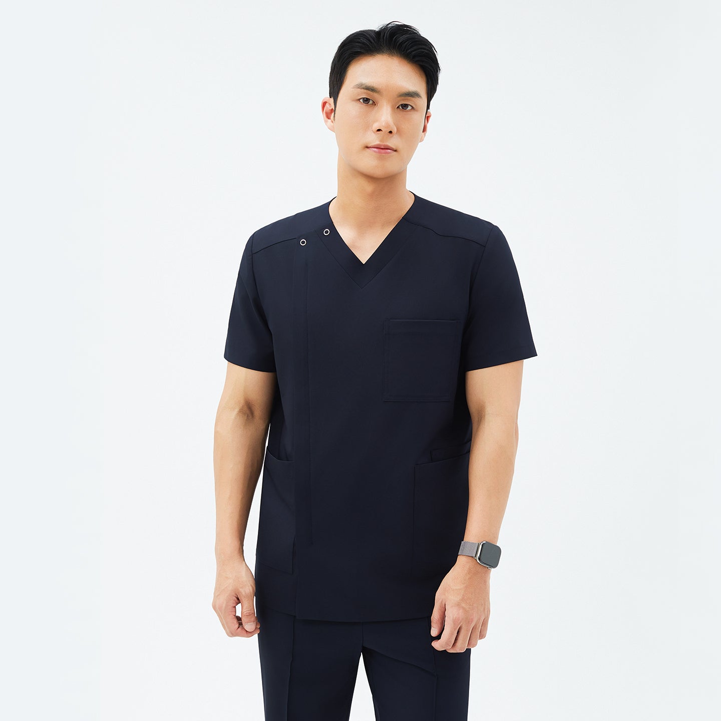 Front view of TUL DS-185 Men's Eco Navy scrub top, highlighting a modern V-snap neckline and practical pockets.