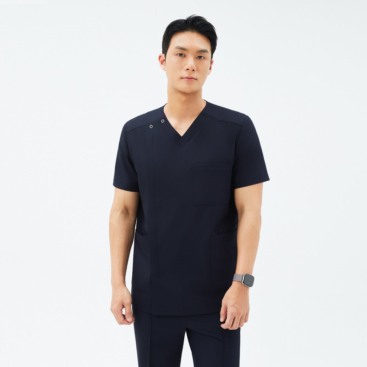 Image of Front view of TUL DS-185 Men's Eco Navy scrub top, highlighting a modern V-snap neckline and practical pockets.
