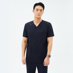 Image of Front view of TUL DS-185 Men's Eco Navy scrub top, highlighting a modern V-snap neckline and practical pockets.