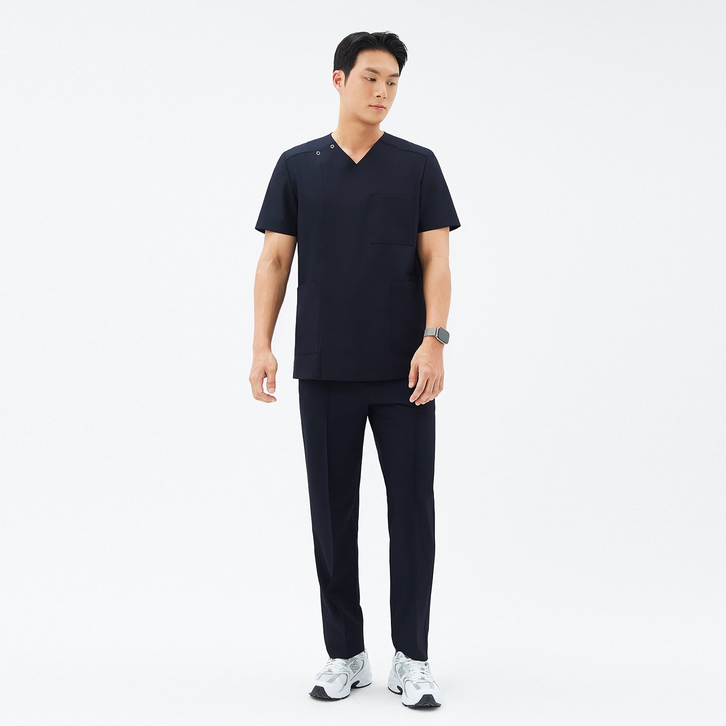 Full-length shot of TUL DS-185 Men's V-Snap Zipper Scrub Top in Eco Navy, paired with matching pants for a cohesive uniform.