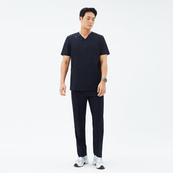 Image of Full-length shot of TUL DS-185 Men's V-Snap Zipper Scrub Top in Eco Navy, paired with matching pants for a cohesive uniform.