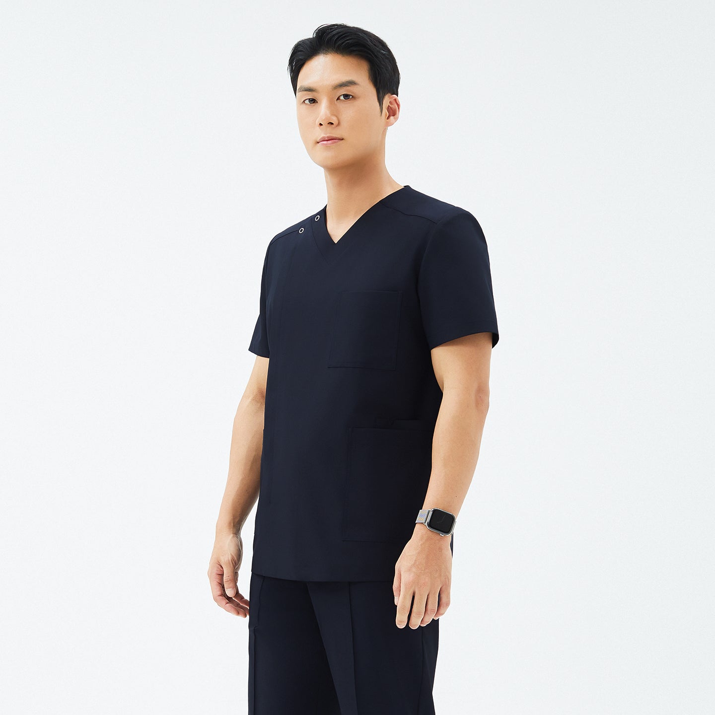 Another angle of TUL DS-185 Men's V-Snap Zipper Scrub Top in Eco Navy, highlighting the sleek silhouette and snap closure detail.