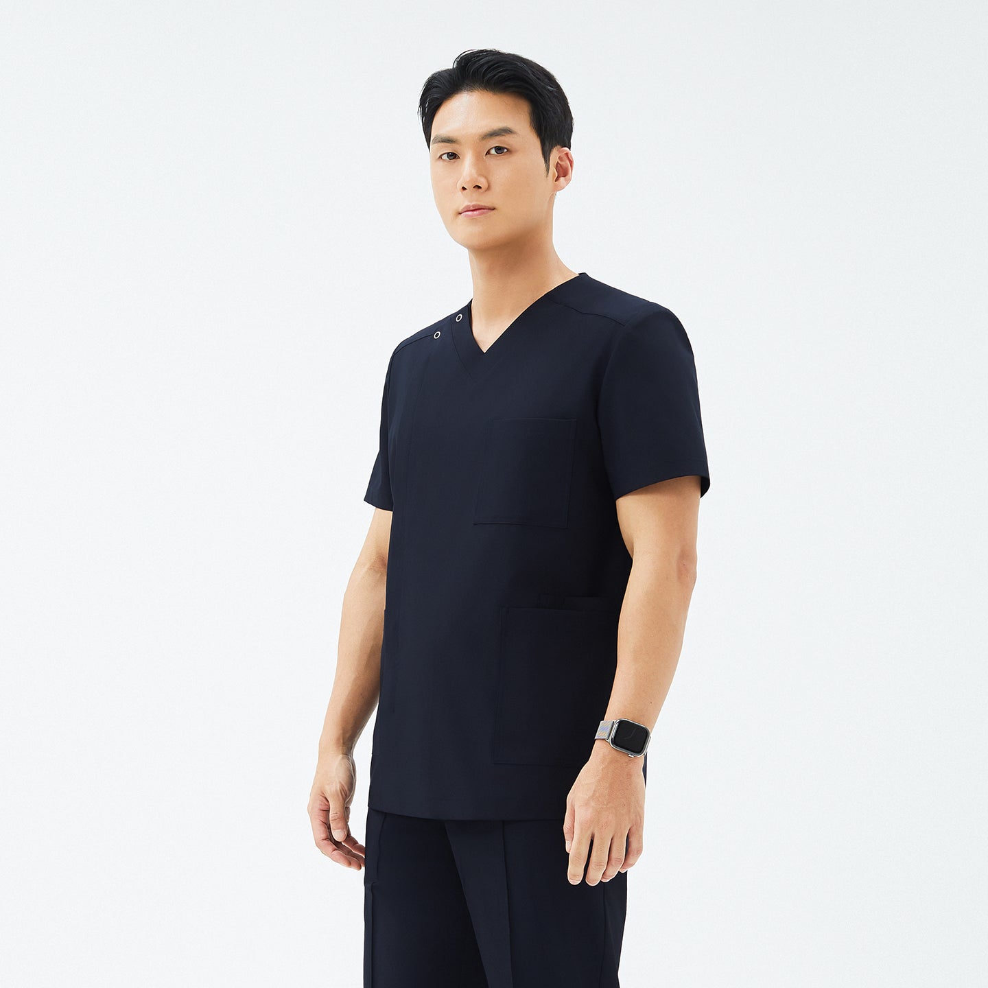 Image of Another angle of TUL DS-185 Men's V-Snap Zipper Scrub Top in Eco Navy, highlighting the sleek silhouette and snap closure detail.
