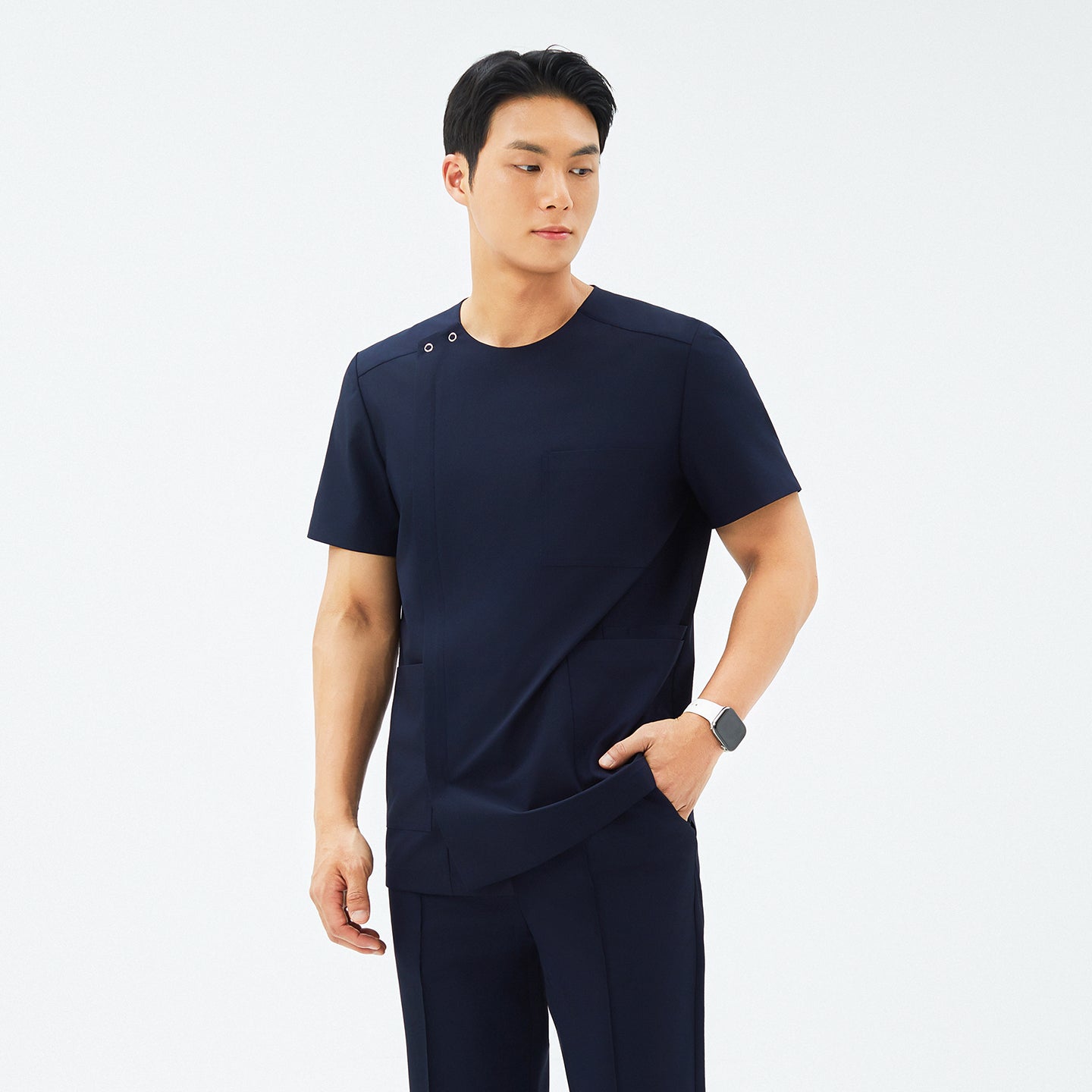 Front view of TUL DS-188 Men's Round Snap Zipper Scrub Top in Eco Navy, showcasing a snap collar detail and sleek front zipper.