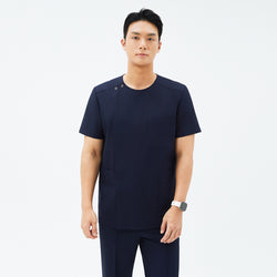 Image of Model wearing TUL DS-188 Men's Eco Navy scrub top, paired with matching pants for a cohesive, professional uniform.