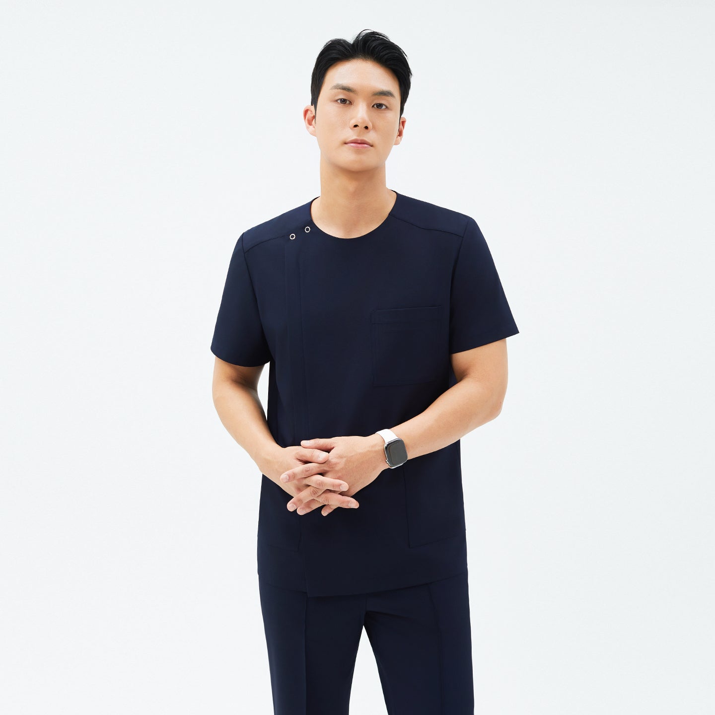 Image of Front view of TUL DS-188 Men's Round Snap Zipper Scrub Top in Eco Navy, showcasing the snap collar, chest pocket, and a sleek, modern fit.