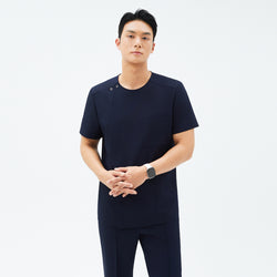 Image of Front view of TUL DS-188 Men's Round Snap Zipper Scrub Top in Eco Navy, showcasing the snap collar, chest pocket, and a sleek, modern fit.