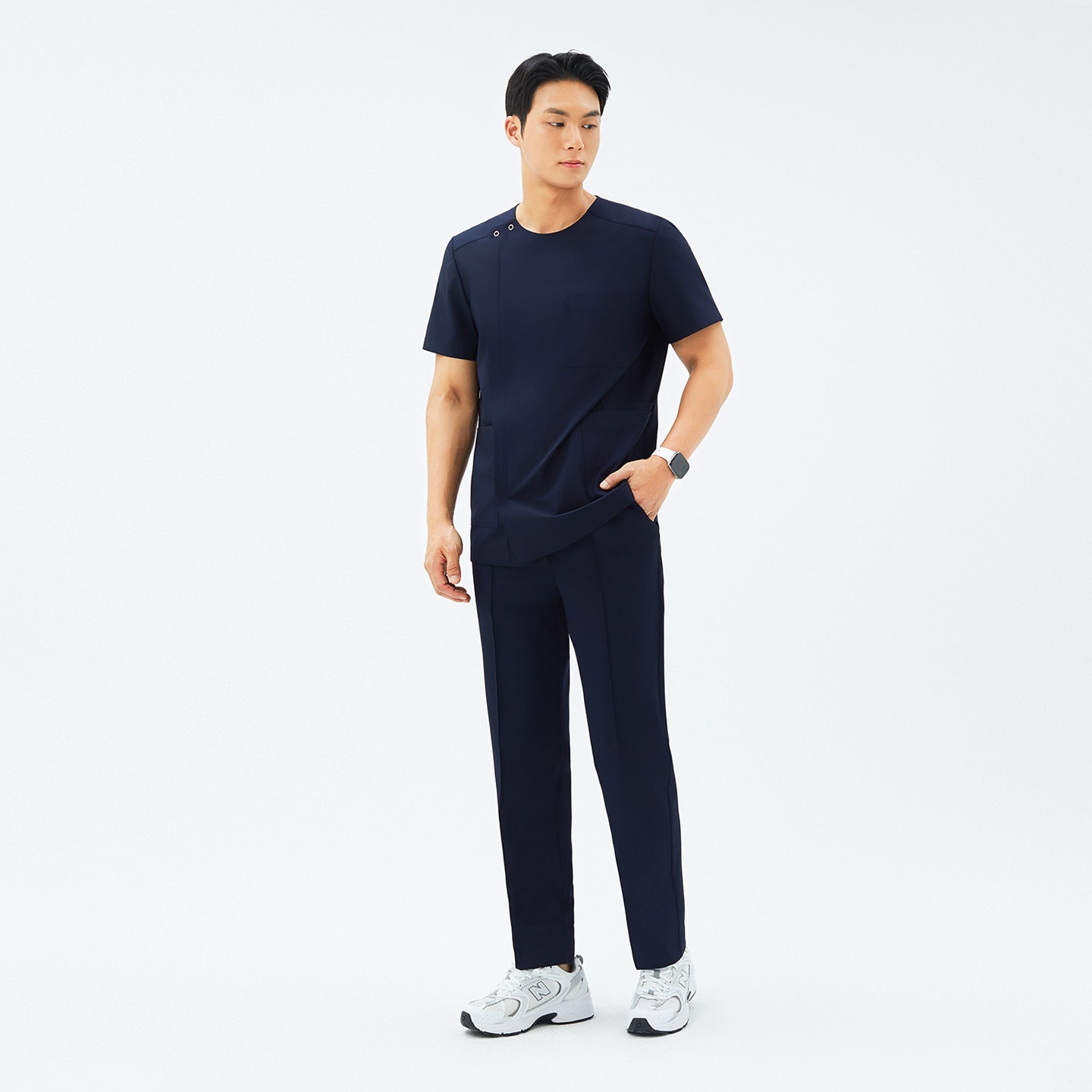 Image of Full-length view of TUL DS-188 Men's Round Snap Zipper Scrub Top in Eco Navy, featuring a snap collar detail, front zipper, and a tailored fit.