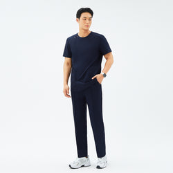 Image of Full-length view of TUL DS-188 Men's Round Snap Zipper Scrub Top in Eco Navy, featuring a snap collar detail, front zipper, and a tailored fit.