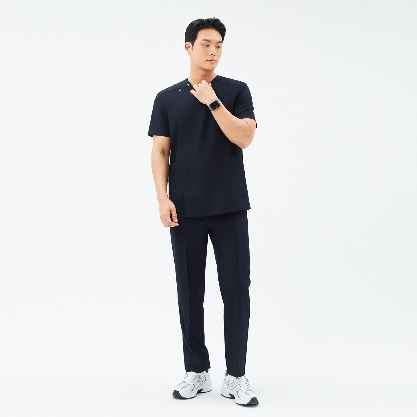 Full-length shot of TUL Men’s Premium Banding Pants in Eco Navy, worn with a matching scrub top for a cohesive, professional look.