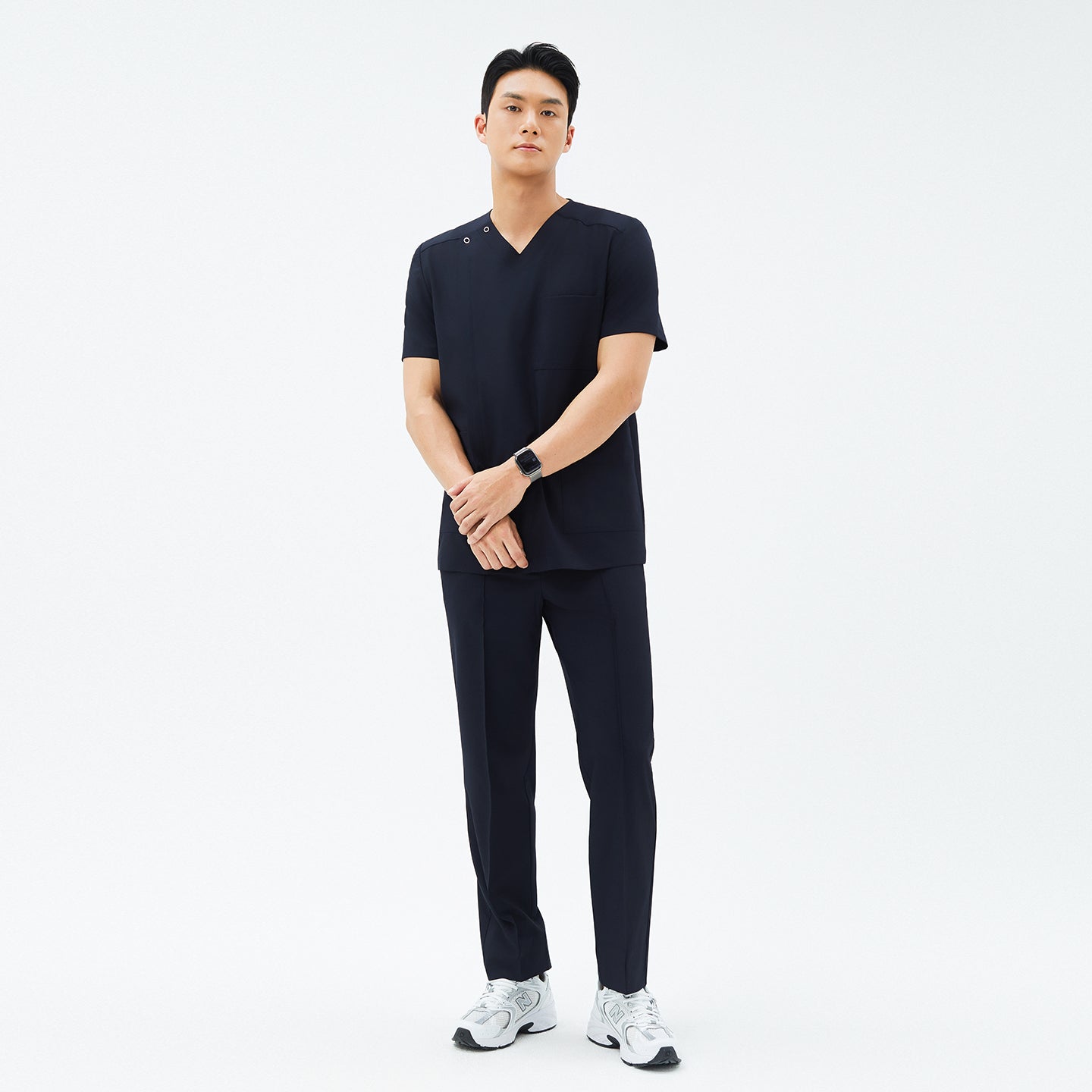 Model wearing TUL Men’s Premium Banding Pants in Eco Navy, featuring structured seams and eco-friendly stretch fabric for comfort.