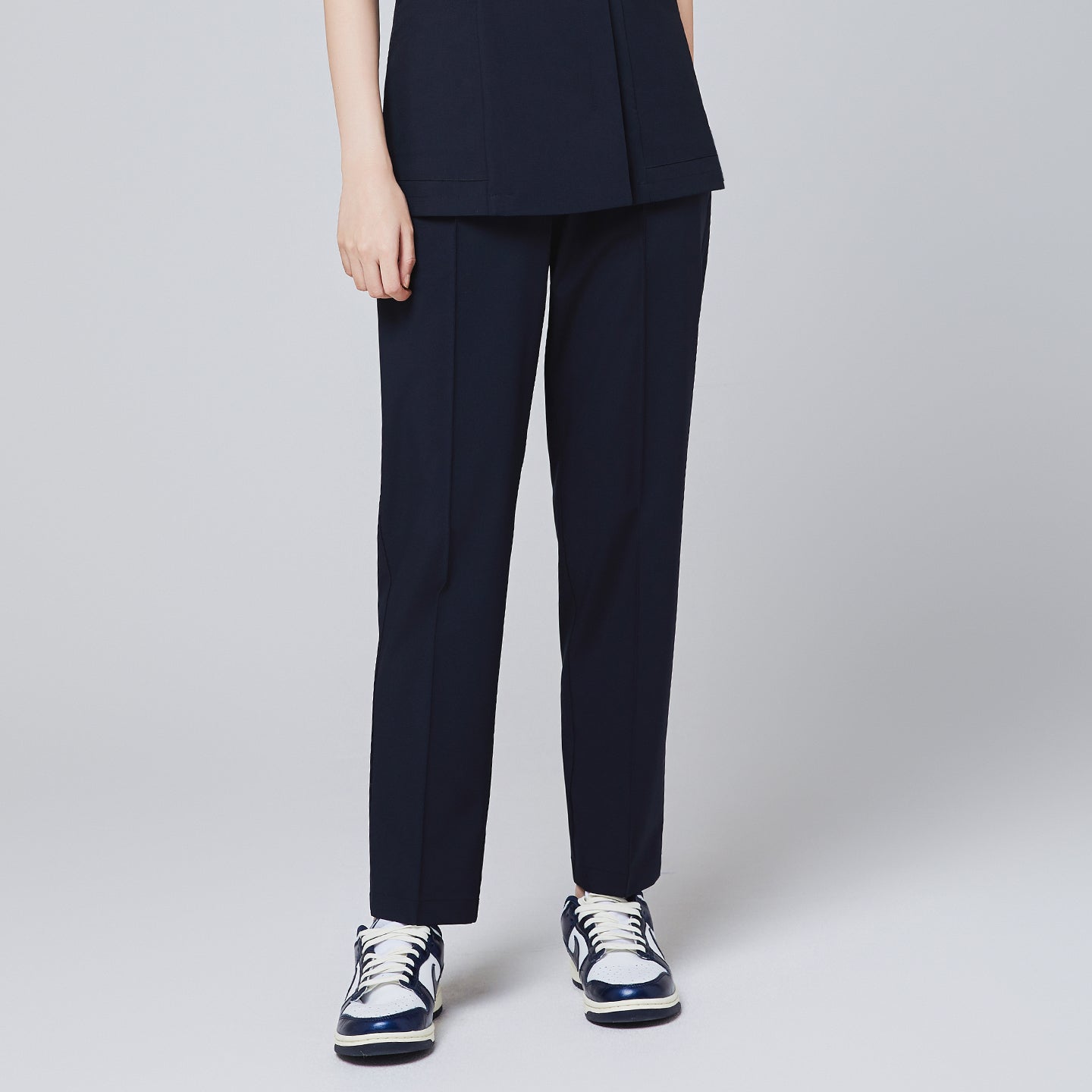 Image of Front view of TUL Women's Premium Banding Pants in Eco Navy, highlighting the tailored cut and premium waistband design.