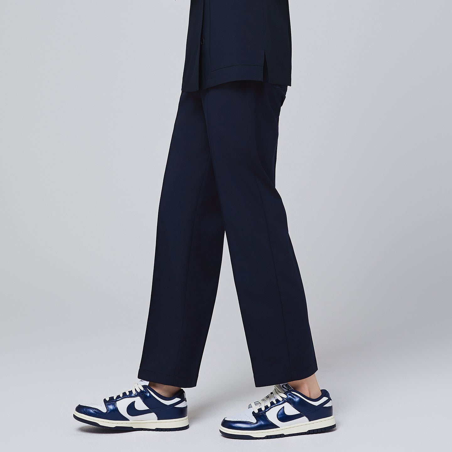 Image of Side profile of TUL Women's Premium Banding Pants in Eco Navy, emphasizing the eco-friendly stretch fabric and modern styling.