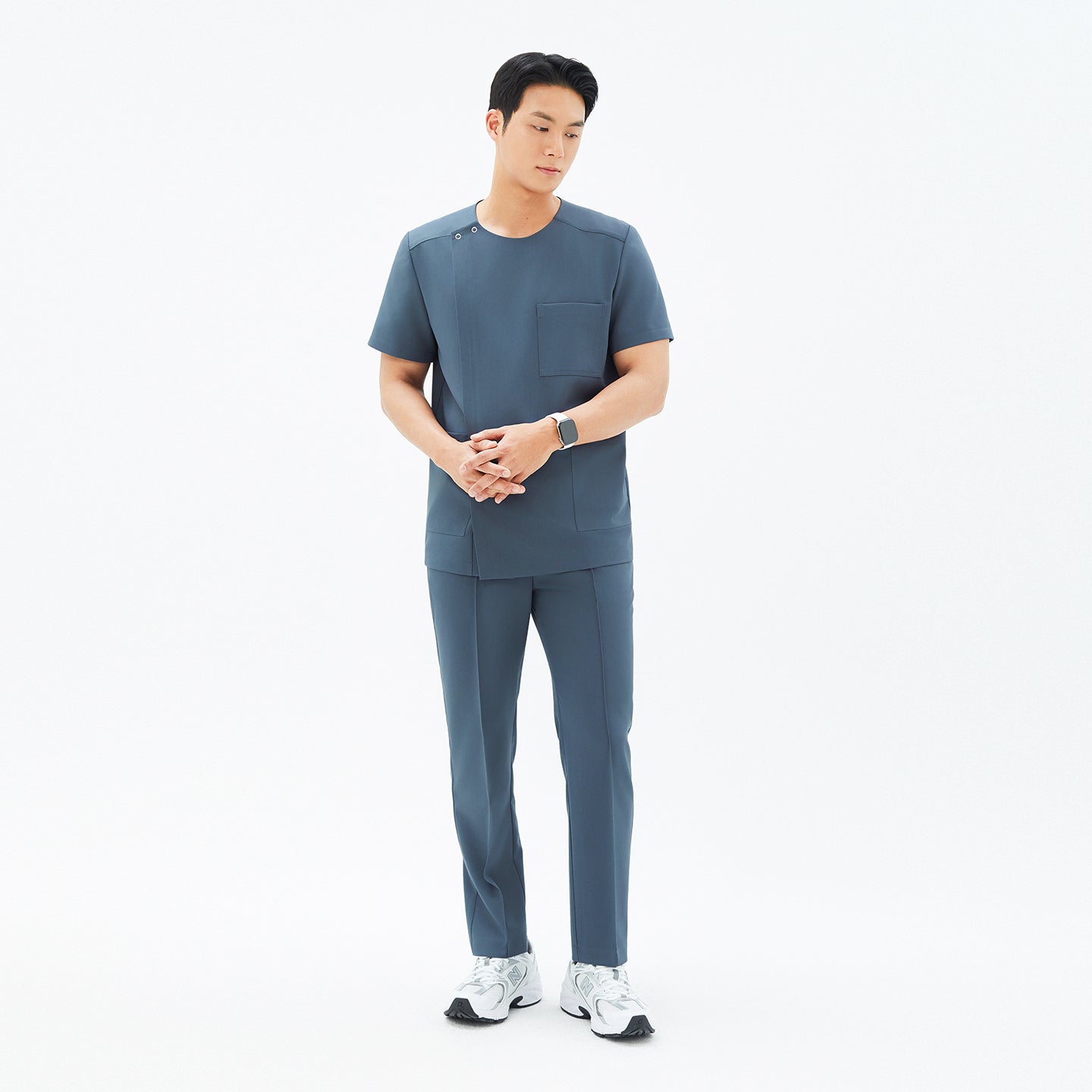 Image of Full-length view of TUL DS-190 Men's Round Snap Zipper Scrub Top in Haze Gray, paired with matching pants for a cohesive uniform look.