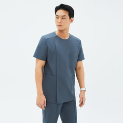 Image of Another angle of TUL DS-190 Men's Round Snap Zipper Scrub Top in Haze Gray, featuring short sleeves and a modern, structured design.