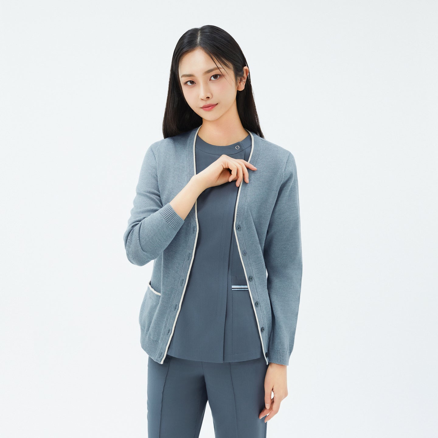 Image of Model wearing TUL CD-99 Essential Knit Cardigan in Soft Mint Gray, showing front pockets and contrast trim for a stylish yet functional design.
