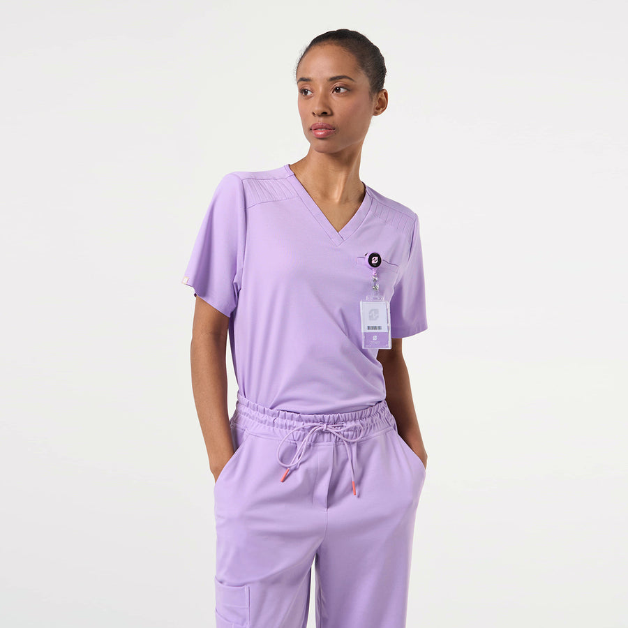 Professional look in a Lavender scrub top paired with matching jogger-style scrub pants.