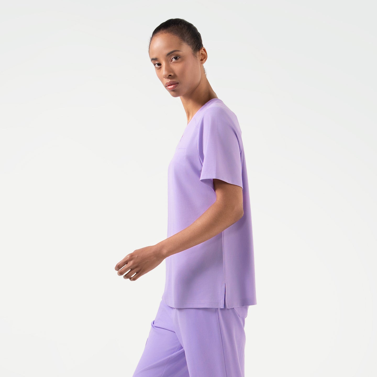 Lavender scrub top paired with matching scrub pants