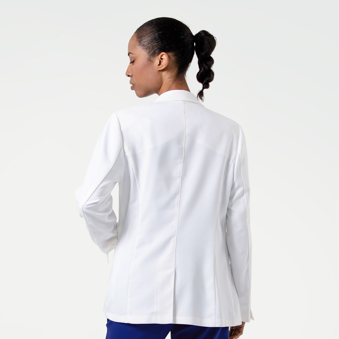 Image of Captured in a back-facing view, the LCW-202 lab coat features a streamlined design with precise stitching and light shaping through the torso, balancing durability, mobility, and a modern, elevated aesthetic.