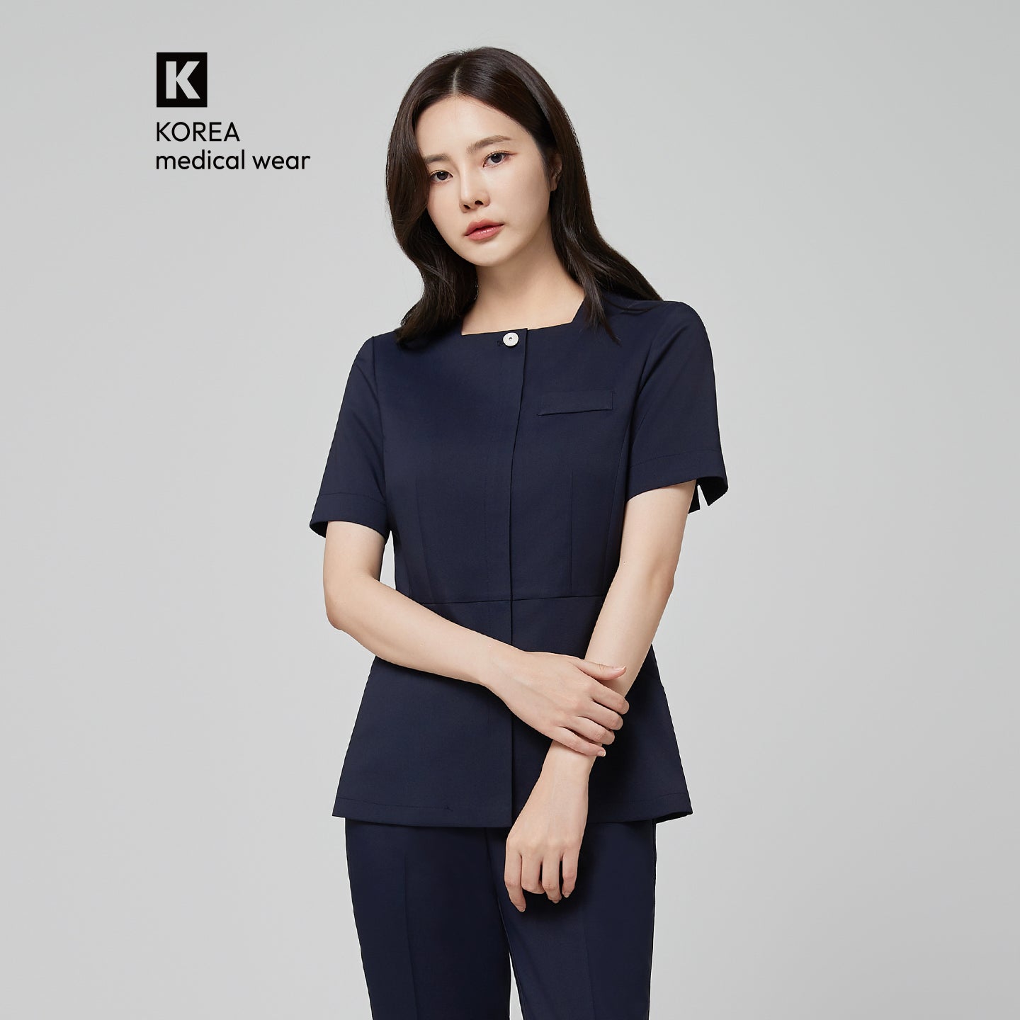 Image of Front view of TUL NS-172 Women’s Modern Square Collar Scrub Top in Mir Navy, featuring a sleek square neckline and a tailored fit.