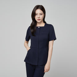 Image of Model wearing TUL NS-172 Women’s Modern Square Collar Scrub Top in Mir Navy, featuring a chest pocket and a contoured waist.