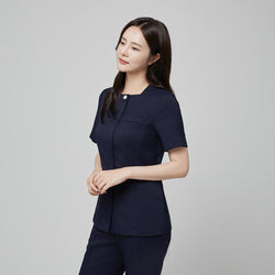 Image of Angled shot of TUL NS-172 Mir Navy scrub top, showing structured seams and a refined, professional fit.