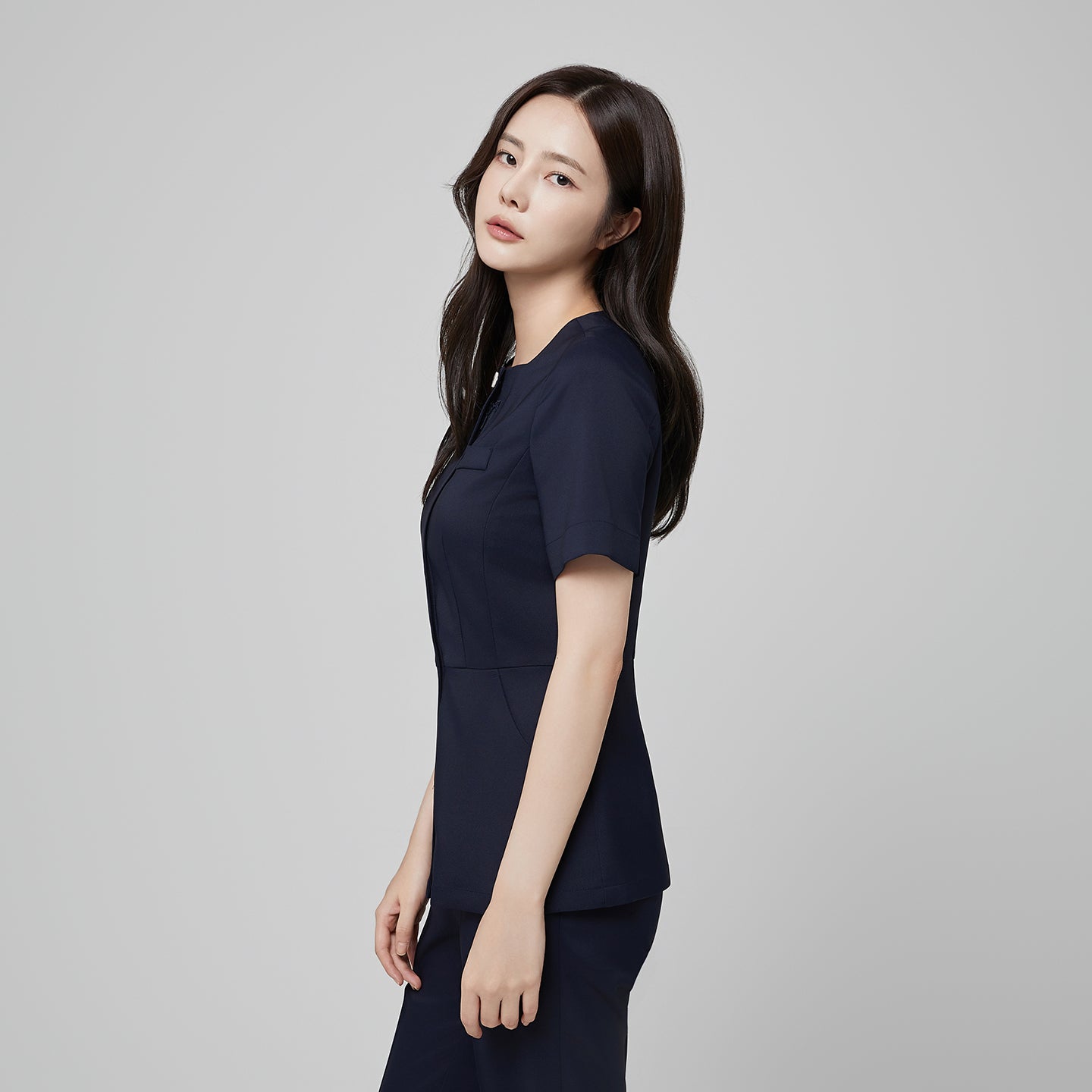 Front angle of TUL NS-172 Mir Navy scrub top, emphasizing the tailored silhouette, short sleeves, and modern square collar.