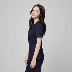Image of Front angle of TUL NS-172 Mir Navy scrub top, emphasizing the tailored silhouette, short sleeves, and modern square collar.