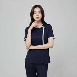 Image of Front angle of TUL NS-174 Women’s Check Gray Round Collar Scrub Top in Mir Navy, highlighting short sleeves and a tailored silhouette.