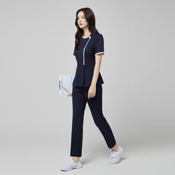 Image of Full-length view of TUL NS-174 Mir Navy scrub top with check gray accents, paired with matching pants for a cohesive professional uniform.