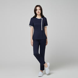 Image of Model wearing TUL NS-174 Mir Navy scrub top with a check gray round collar, showcasing a modern, polished fit and coordinating navy pants.