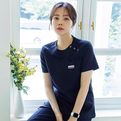 Image of TUL | OS-133 Women's Snap Button Scrub Top - Mir Navy