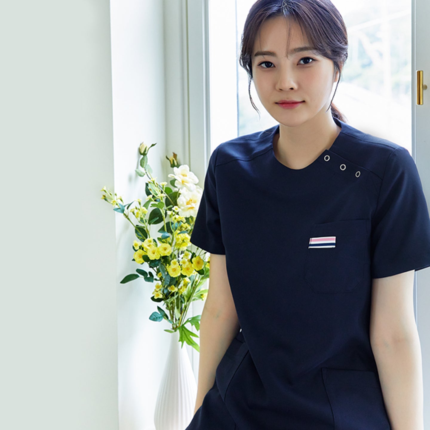 Image of TUL | OS-133 Women's Snap Button Scrub Top - Mir Navy