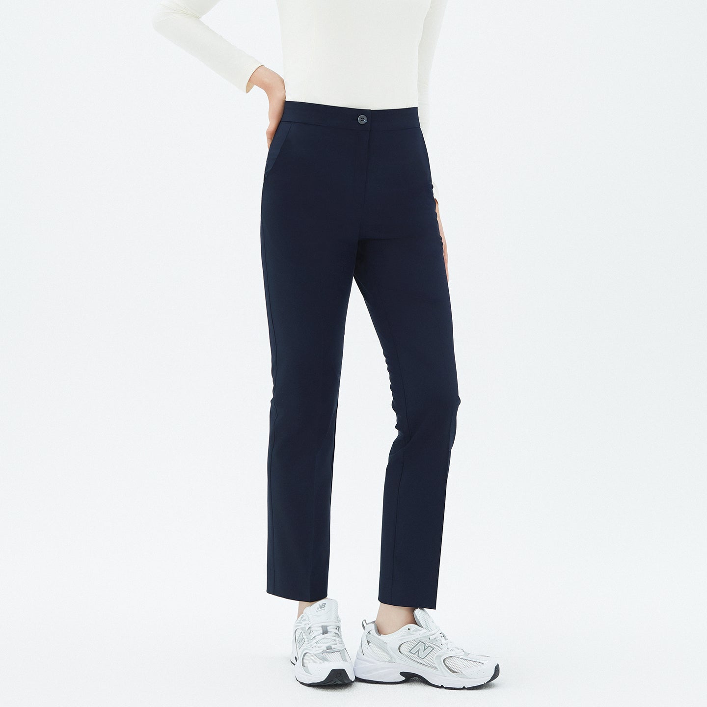 Front view of TUL Women’s Side Hidden Banding Pants in Mir Navy, featuring a button closure and hidden side band for added comfort.